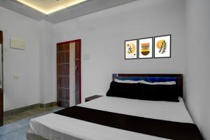 Ένα ή περισσότερα κρεβάτια σε δωμάτιο στο SPOT ON Khushi Lodge