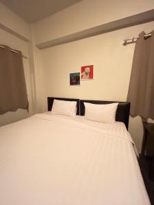 Ένα ή περισσότερα κρεβάτια σε δωμάτιο στο Comfy Hotels Suvarnabhumi Airport +117 φωτογραφίες
