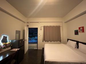 Ένα ή περισσότερα κρεβάτια σε δωμάτιο στο Comfy Hotels Suvarnabhumi Airport