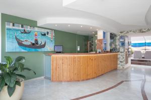 a lobby with a reception desk and a boat on the wall at Apartamentos las Góndolas in Playa del Ingles +26 photos