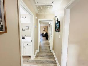 a hallway with a sink and a bathroom at Eastgate 9A Beautiful Townhouse in Hammond +73 photos