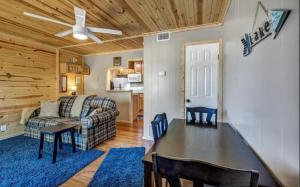 a living room with a table and a couch at Waterfront Getaway Lake Access Deck BBQ Grill in Kingsland