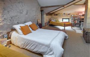 a bedroom with a large bed with orange pillows at Superbe Maison Avec Piscine in Mombrier +38 photos