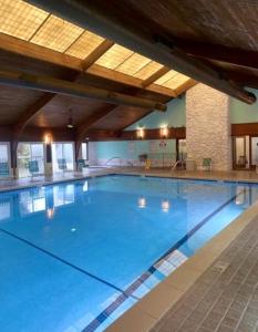 a large swimming pool in a large building at Three Little Birds in Kure Beach