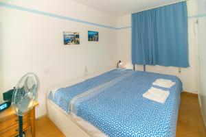 En eller flere senge i et værelse på WELCS APARTAMENTO 293 EMP en el centro