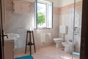 a bathroom with a toilet and a sink at Al Primo Piano in Forio d'Ischia