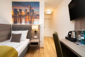 TV a/nebo společenská místnost v ubytování Sophien Hotel