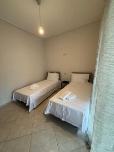 En eller flere senge i et værelse på T-Book365 Green