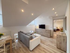 a living room with a couch and a table at The Lion Rooms in Ustroń