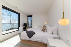 Postel nebo postele na pokoji v ubytování Le Föss, Fleuve, Sauna & Spa