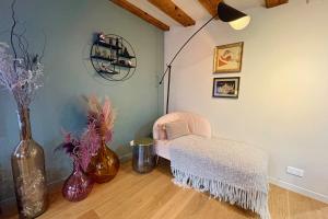 a room with a chair and vases on the floor at Luxury apartment in the city center in Strasbourg