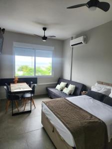 Giường trong phòng chung tại Kitnet com VISTA MAR em Santos