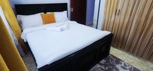 Ένα ή περισσότερα κρεβάτια σε δωμάτιο στο KeenStays Isiolo Town
