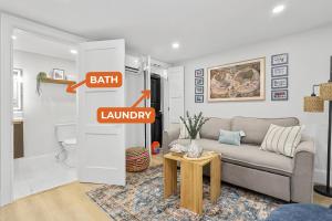 a living room with a couch and a table at North End Entire House in Boston +83 photos