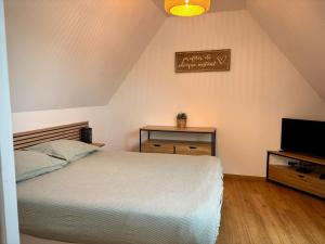 Postel nebo postele na pokoji v ubytování Maison spacieuse et lumineuse