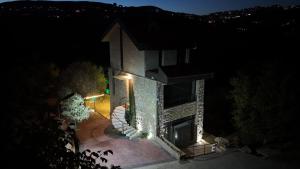 an overhead view of a house at night at Moonvalley in ‘Ayn Qanīyah