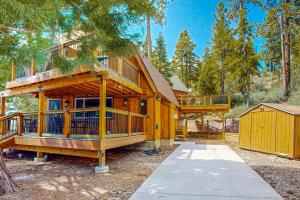 a large wooden house with a large deck at Primrose Cabin #709 in Big Bear Lake