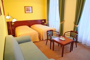 Postel nebo postele na pokoji v ubytování Grandhotel Garni