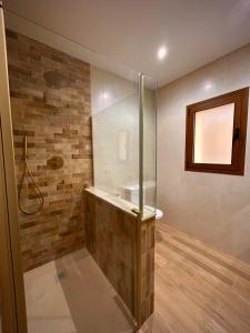 a bathroom with a shower and a sink at La villa de Ramona in Argamasilla de Alba +15 photos