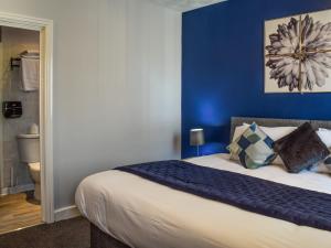 Ένα ή περισσότερα κρεβάτια σε δωμάτιο στο The Sandcastle