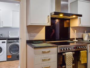 Kuchyň nebo kuchyňský kout v ubytování The Sandcastle