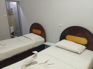 Voodi või voodid majutusasutuse King Square B&B Hostel luxor toas