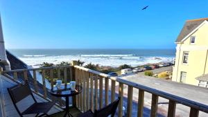 a balcony with a view of the ocean at Shellsborough Penthouse in Woolacombe