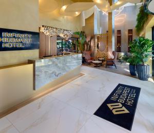 a lobby with a hotel sign on the floor at INFINITY Budapest Hotel - Adults Only in Budapest +159 photos