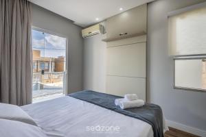 Ένα ή περισσότερα κρεβάτια σε δωμάτιο στο Casa c/ Churrasqueira a 550 m da Praia PDD0572