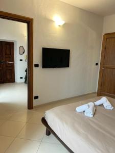 TV a/nebo společenská místnost v ubytování Il Nido dei Mondagli