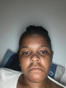 a woman laying on a bed looking at the camera at Rejoice Thuli in Mabopane