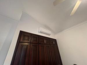 a room with a door with a air conditioner above it at Apartment with garden views 525 in Punta Cana
