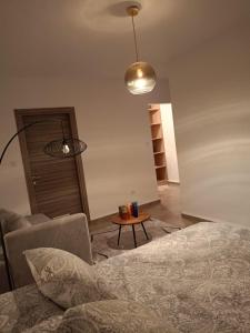 Ένα ή περισσότερα κρεβάτια σε δωμάτιο στο Vue mer residence bessa