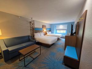 Ένα ή περισσότερα κρεβάτια σε δωμάτιο στο Days Inn & Suites by Wyndham Brandon Amphitheater +21 φωτογραφίες