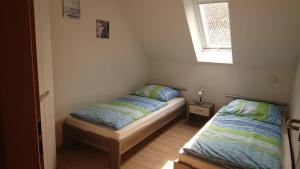 Ένα ή περισσότερα κρεβάτια σε δωμάτιο στο FeWo2 Griese