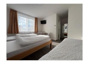 Postel nebo postele na pokoji v ubytování Ubytování V Panské zahradě