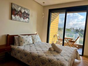 Postel nebo postele na pokoji v ubytování Casablanca Luxury Studio - Family & Solo Friendly