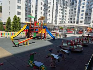 a playground with a slide at Apartament new in Chişinău