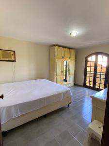 Ένα ή περισσότερα κρεβάτια σε δωμάτιο στο Sobrado Guaratuba 3 quartos +4 φωτογραφίες