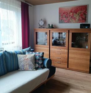 a living room with a couch and a large entertainment center at Casa del Norte in Brackenheim +16 photos