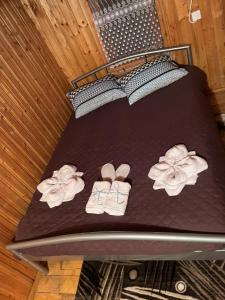 a bunk bed with shoes and flowers on it at Cabana Paltini 