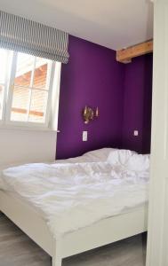 Postel nebo postele na pokoji v ubytování Hof-Ruesch-FeWo-Fohlenkoppel