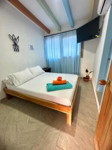 Ένα ή περισσότερα κρεβάτια σε δωμάτιο στο Hotel bosque blue