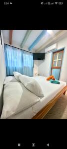 Ένα ή περισσότερα κρεβάτια σε δωμάτιο στο Hotel bosque blue