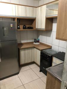 Η κουζίνα ή μικρή κουζίνα στο Kitnet Aconchego Morro de São Paulo