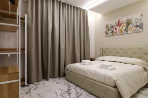 Ένα ή περισσότερα κρεβάτια σε δωμάτιο στο b&b la cattedrale