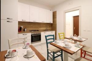 a kitchen and dining room with a table and chairs at b&b la cattedrale in Avezzano