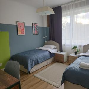 Postel nebo postele na pokoji v ubytování Gästehaus Bergedorf 2