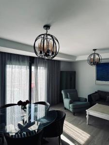 a living room with a table and a couch at Atlantic View Duplex Tawenza Bay in Taghazout