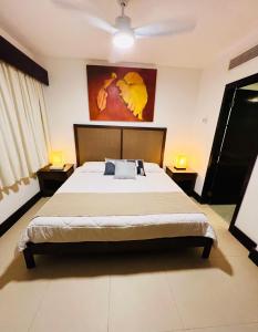 En eller flere senge i et værelse på Aldea Thai Downtown Oceanview Residences